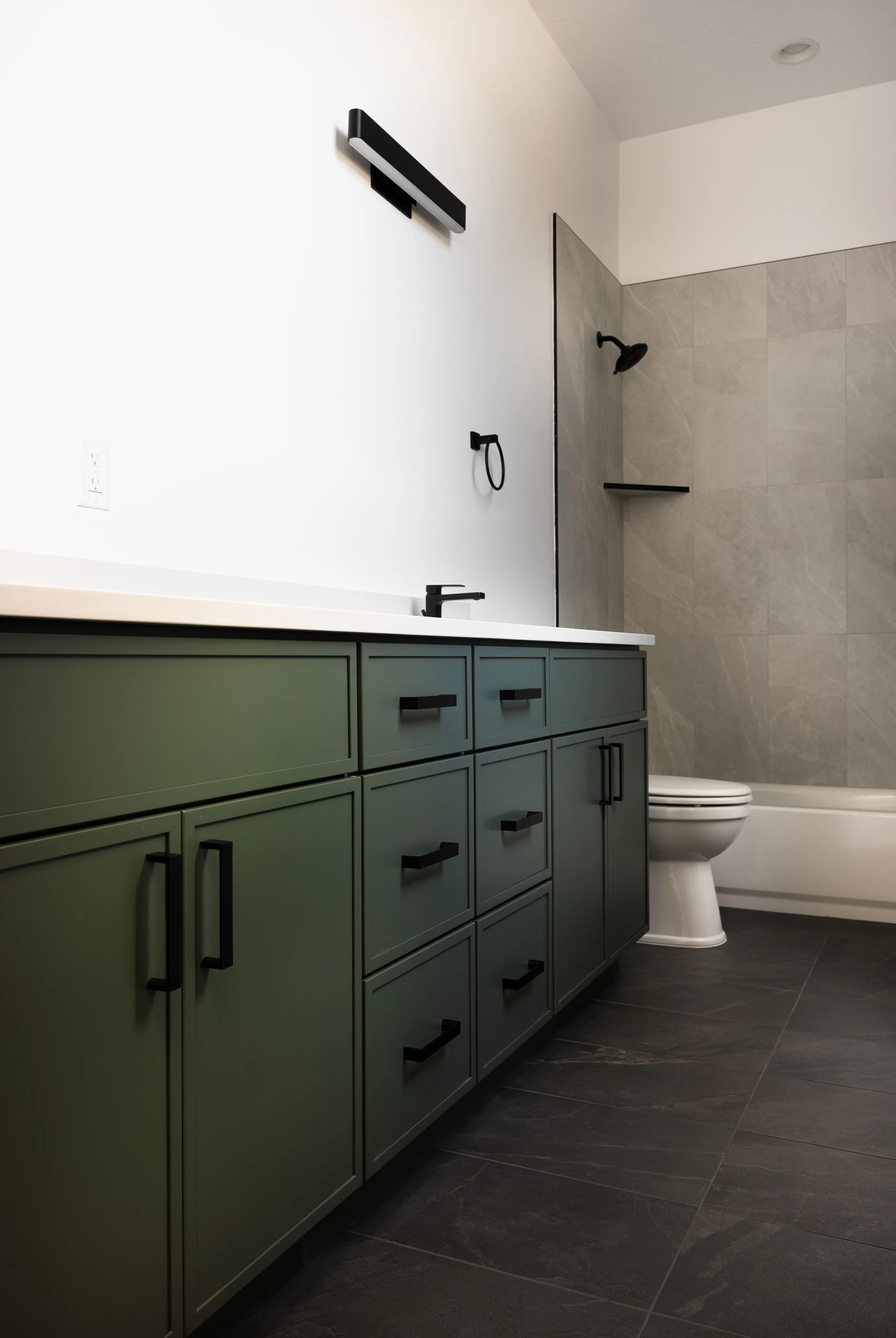 Olive-green bath vanity with matte-black pulls from our Dixie Springs build